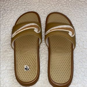 Yellow and brown Nike slides with box